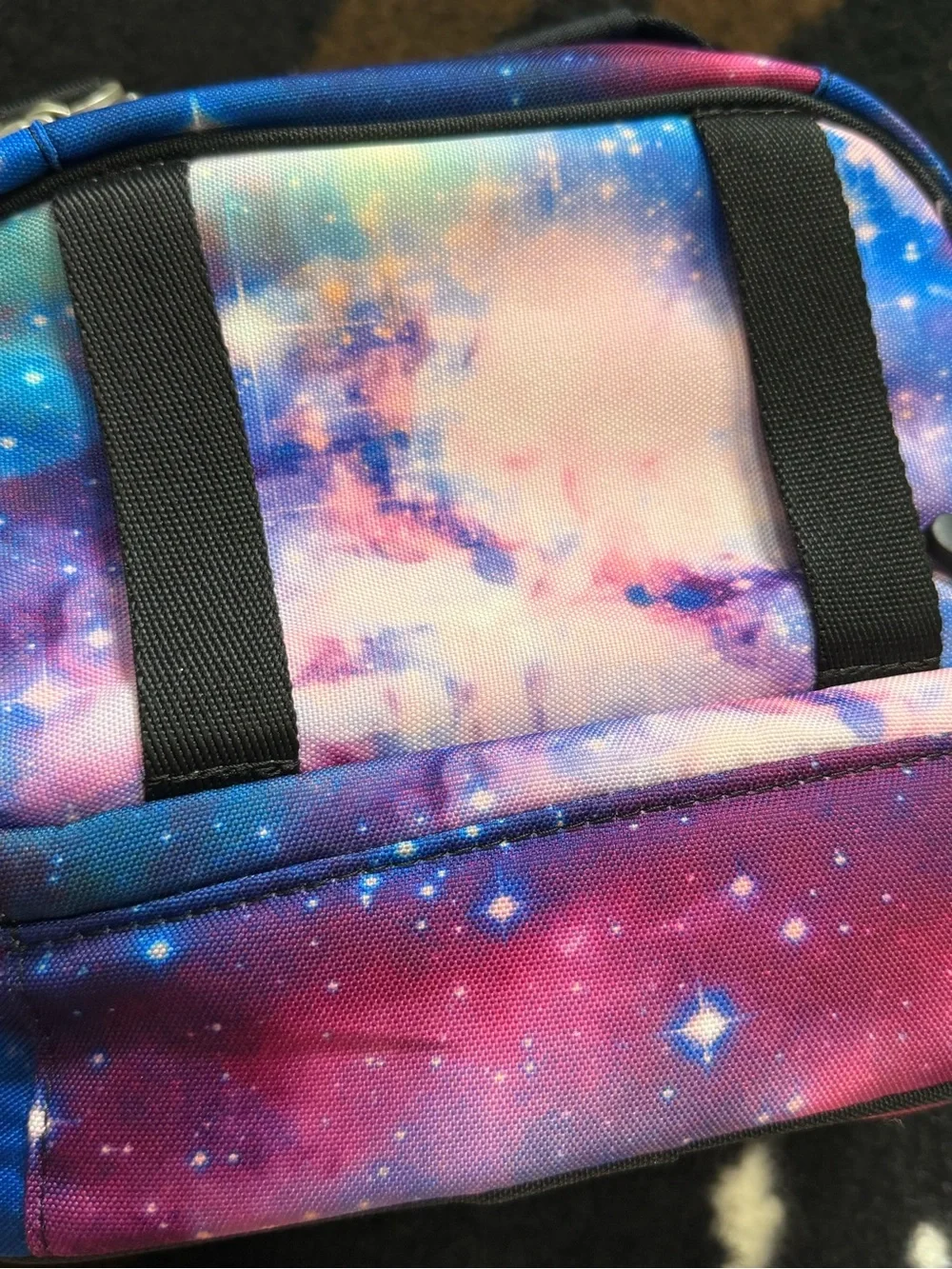 Colorful Pottery Barn Teen lunch bag featuring a vibrant galaxy print in shades
